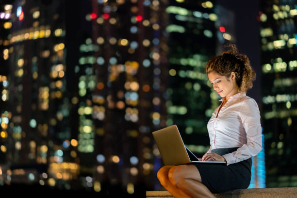 istock Successful business woman at night working online using a laptop 1139805762