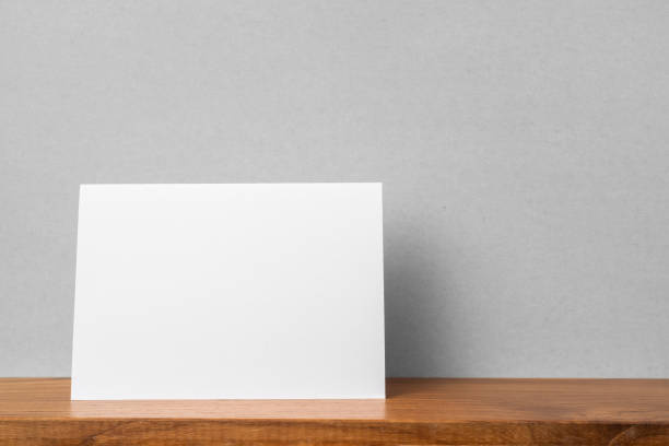 istock front view of greeting card on bookshelf and grey wall 1139807379