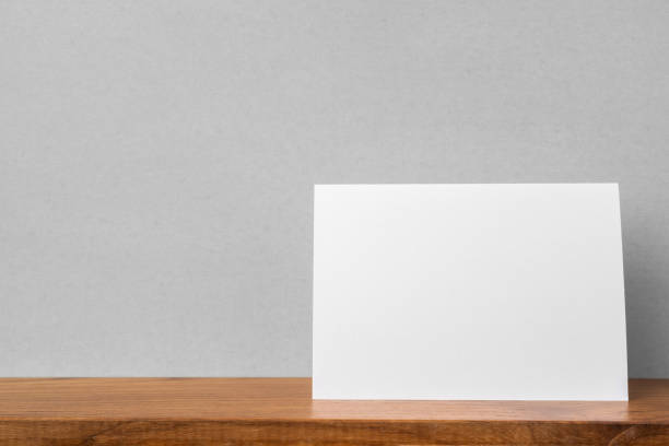 istock front view of greeting card on bookshelf and grey wall 1139807393