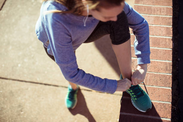 istock Woman Tying Shoelaces 1139808179