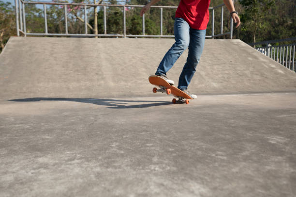 istock Skateboarder skateboarding at skatepark ramp 1139810102