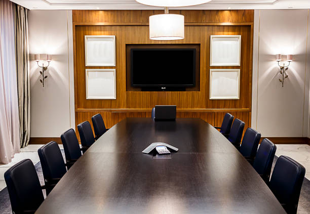 istock Empty Boardroom With Laptop at Head of Table 1139810168