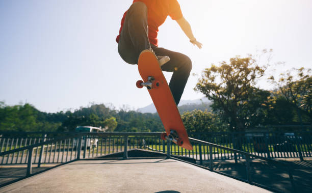 istock Skateboarder skateboarding at skatepark ramp 1139810273