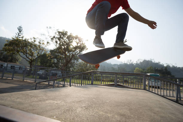 istock Skateboarder skateboarding at skatepark ramp 1139810308