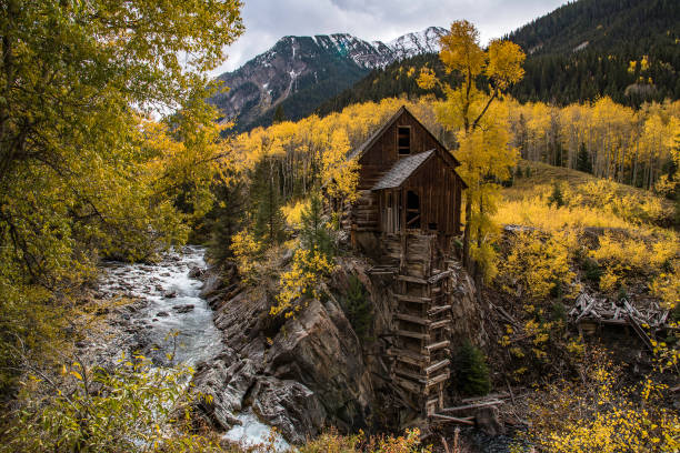 istock Old power generator mill Aspen area 4x4 road through aspen trees 1139810432