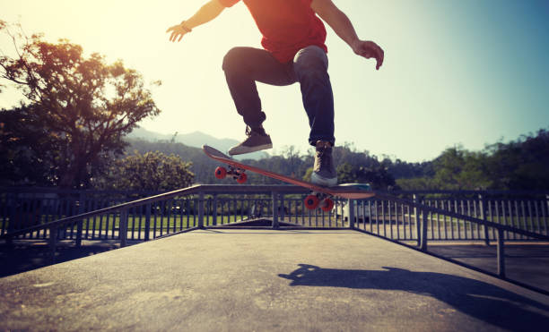 istock Skateboarder skateboarding at skatepark ramp 1139810454