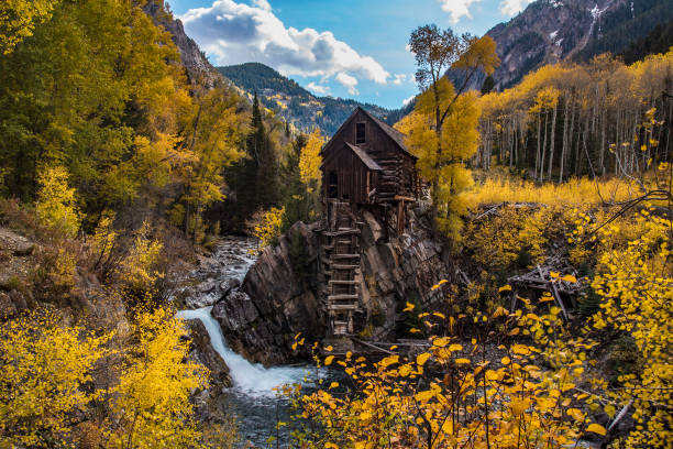 istock Old power generator mill Aspen area 4x4 road through aspen trees 1139811498