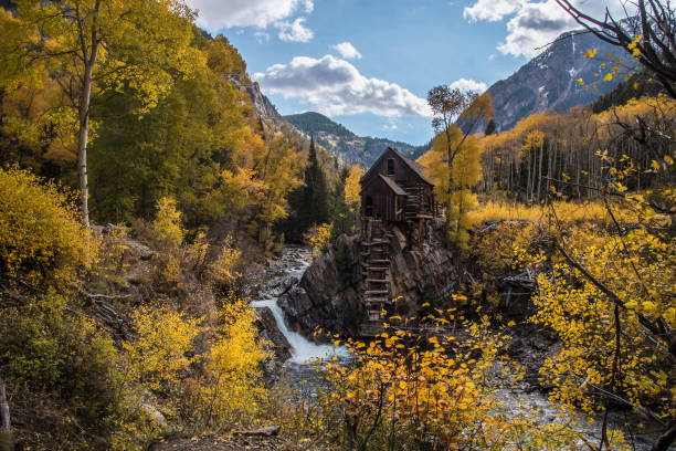 istock Old power generator mill Aspen area 4x4 road through aspen trees 1139812156