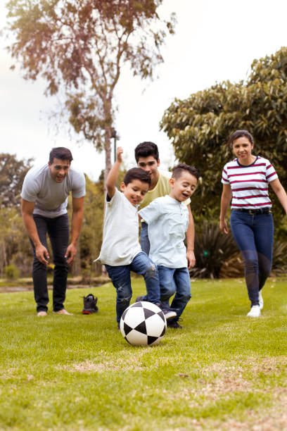 istock Family group playing soccer 1139815017