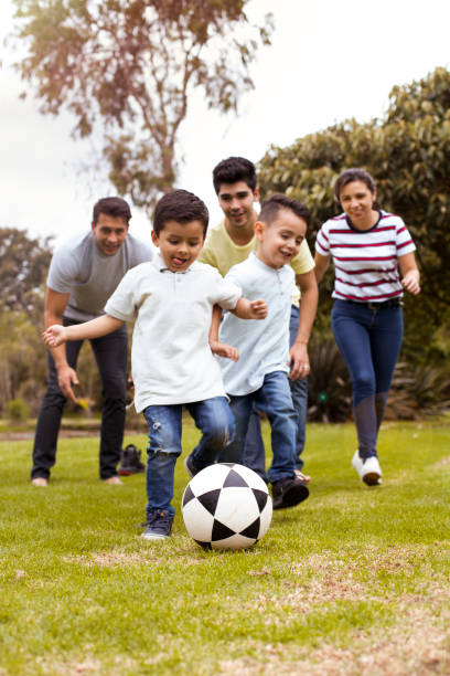 istock Family group playing soccer 1139815043