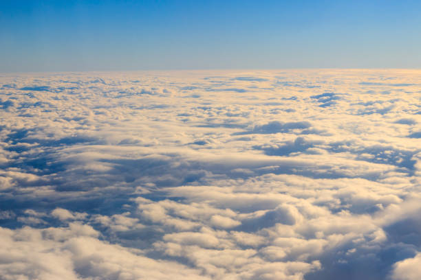 istock Beautiful white clouds in blue sky. View from airplane 1139820548