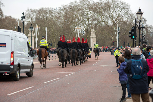 London, UK - March 22, 2019:  Household Cavalry Mounted Regiment riding their horses during the Changing the Guards military ceremony in London