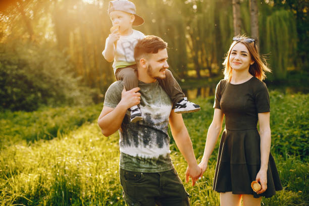 istock Cute family in a park 1139825014