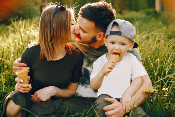 istock Cute family in a park 1139825904