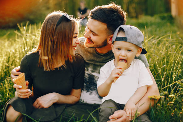 istock Cute family in a park 1139825957