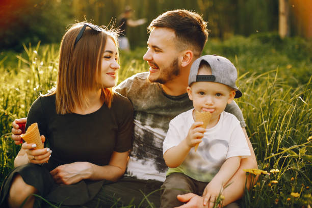 istock Cute family in a park 1139826022