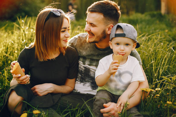 istock Cute family in a park 1139826049