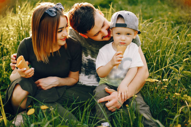 istock Cute family in a park 1139826080