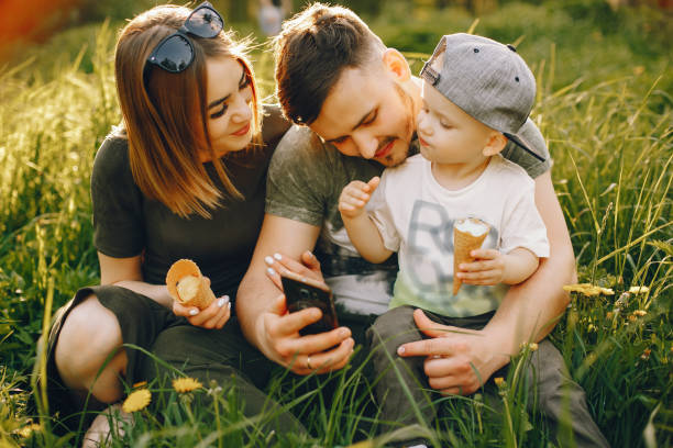 istock Cute family in a park 1139826196