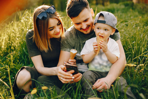 istock Cute family in a park 1139826246