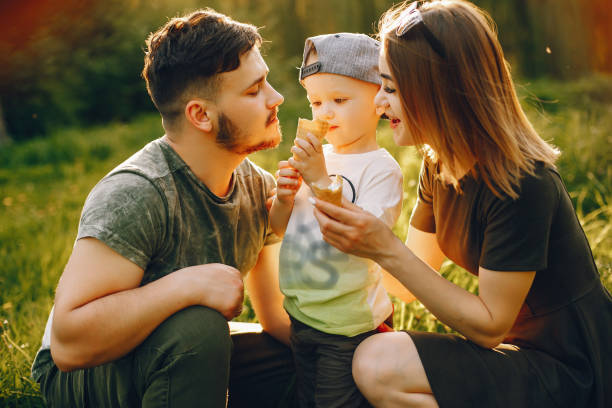 istock Cute family in a park 1139826831