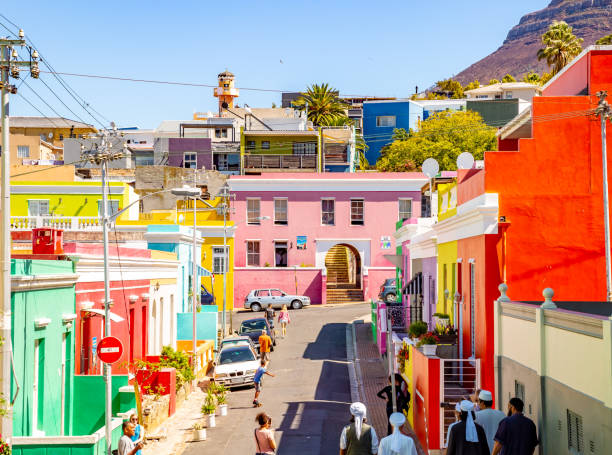 Bo Kaap Township in Cape Town This pic shows colorful township of BoKaap in capetown. The famous muslim quarter called Bo Kaap in Cape Town, South Africa. This quarter, also called The Malay Quarter, is situated at the foot of signal hill and consits out of lots of colurful houses and mosques. Tourists are strolling around the scenery. The pic is taken in march 2019 in day time. malay quarter photos stock pictures, royalty-free photos & images
