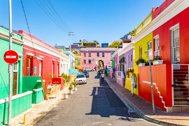Bo Kaap Township in Cape Town This pic shows colorful township of BoKaap in capetown. The famous muslim quarter called Bo Kaap in Cape Town, South Africa. This quarter, also called The Malay Quarter, is situated at the foot of signal hill and consits out of lots of colurful houses and mosques. Tourists are strolling around the scenery. The pic is taken in march 2019 in day time. malay quarter photos stock pictures, royalty-free photos & images