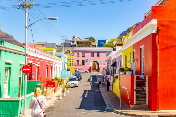 Colorful houses in  Bo Kaap Malay Quarter, Cape Town This pic shows colorful township of BoKaap in capetown.  The famous muslim quarter called Bo Kaap in Cape Town, South Africa. This quarter, also called The Malay Quarter, is situated at the foot of signal hill and consits out of lots of colurful houses and mosques. Tourists are strolling around the scenery. The pic is taken in march 2019 in day time. malay quarter photos stock pictures, royalty-free photos & images