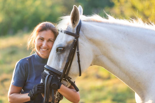 istock Woman hugging her horse 1139837159