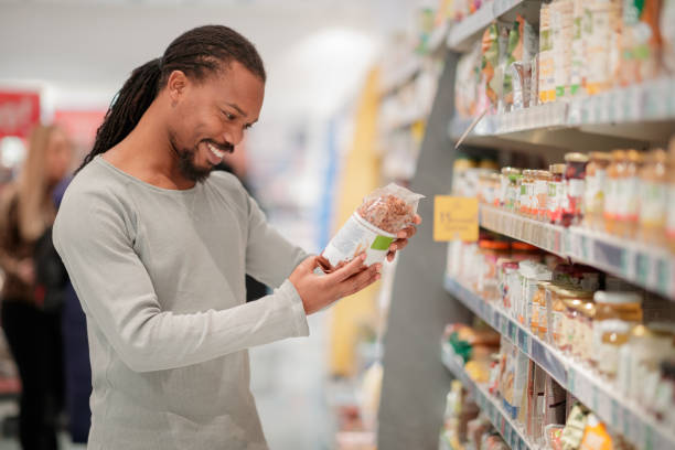 istock Man reading label on organic cereals 1139837578