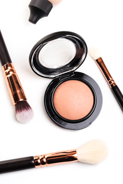 istock eye shadow, blush, powder, sculptor in a pack with make up brushes on a white background. Isolated on white. - Image 1139837804