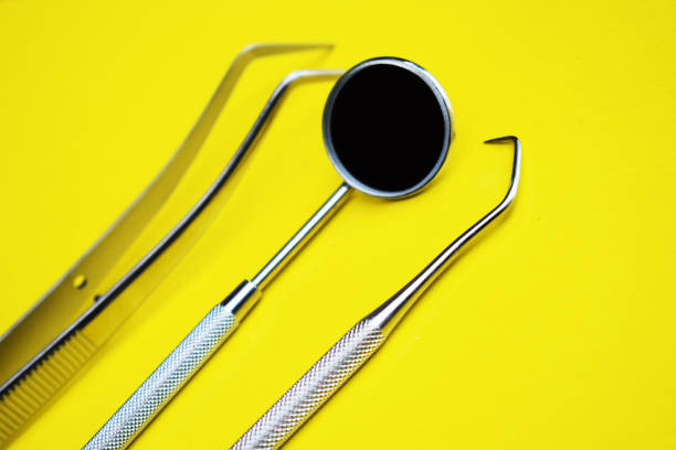 istock Tools for dental treatment on a yellow background 1139838475