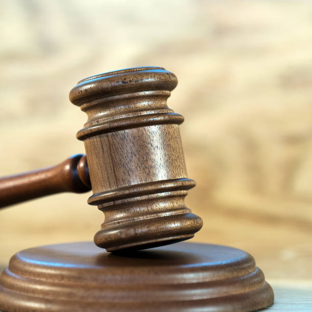 istock Law and justice concept image. Brown wooden background 1139839155