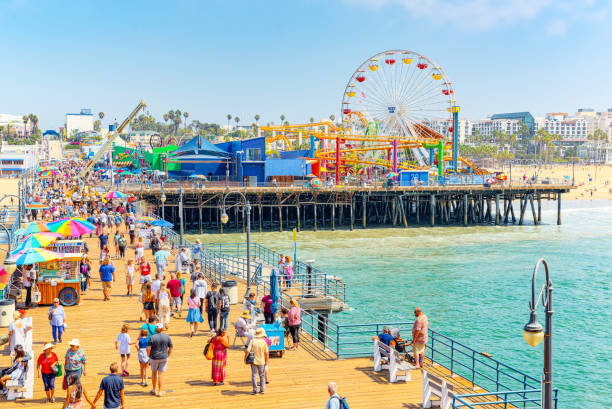 Famous Pier in Santa Monica with tourists, a suburb of Los Angeles. stock photo