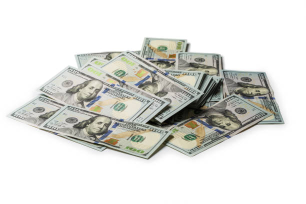 istock Many bundle of US 100 dollars bank notes isolated on white background 1139841017