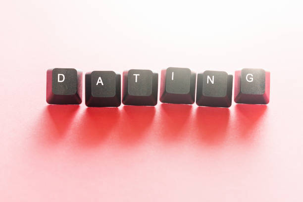 istock Computer keyboard keys spell out DATING on pink 1139841361