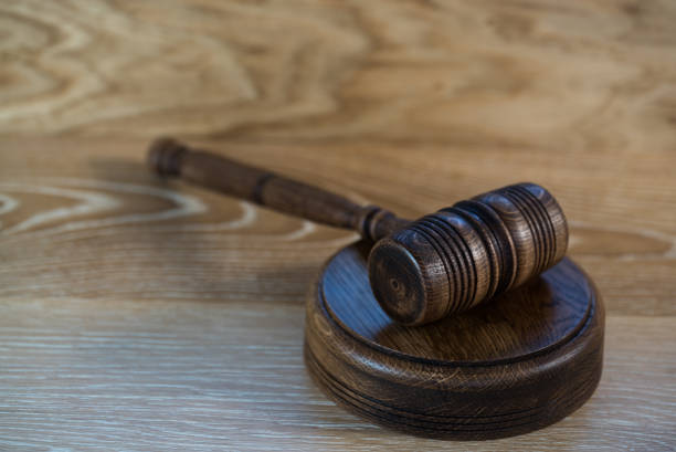 istock Law and justice concept image. Brown wooden background 1139841387