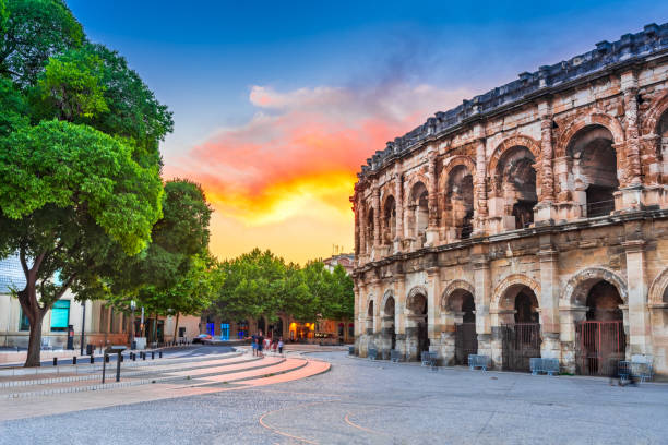 Nimes, France - Ancient Roman Arena Nimes, France. Ancient Roman amphitheatre in the Occitanie region of southern France. amphitheater stock pictures, royalty-free photos & images