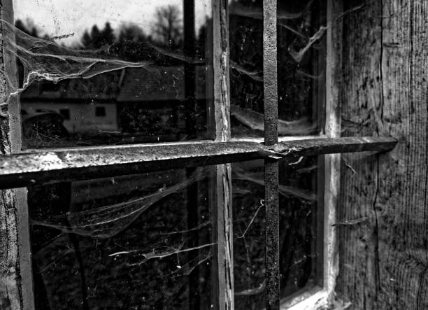istock old cottage hut window black and white 1139842754