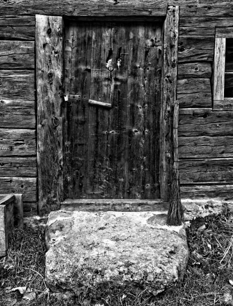 istock old cottage hut door black and white 1139842761