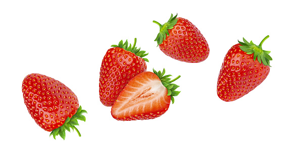 Falling strawberries isolated on white background with clipping path