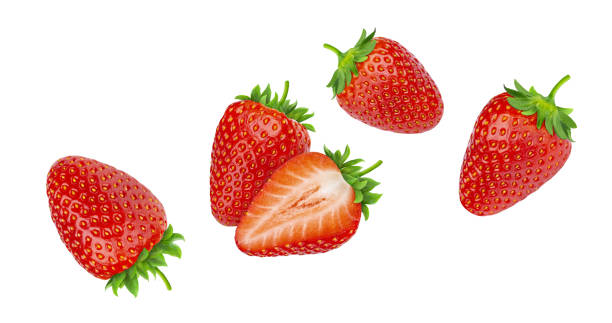 falling strawberries isolated on white background - morango imagens e fotografias de stock