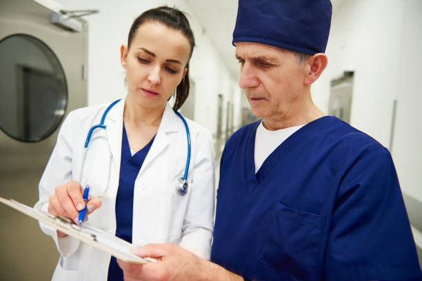 istock Two doctors discussing some medical records in the corridor 1139845789