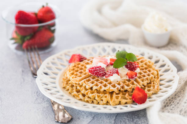 istock Waffles with strawberries and cream 1139845832