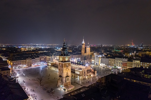 Aerial drone view Cracow old town and city main square at night. Cracow, Lesser Poland