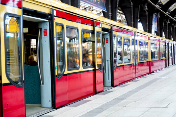 istock Red train on railroad station with opened doors in Berlin, Germany. 1139846001
