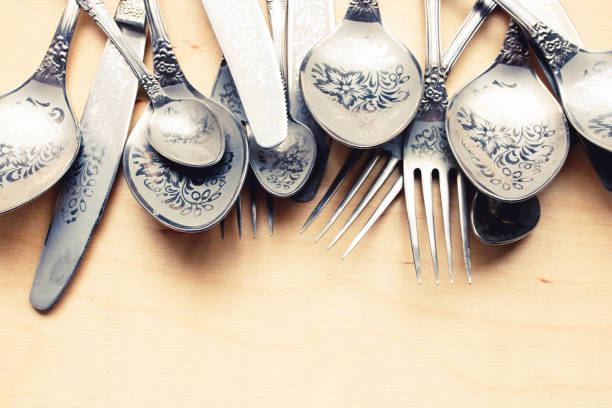 istock Set of old fashioned silver cutlery. Silverware with engraving. 1139846173