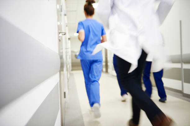 istock Team of doctors running in a hurry 1139846252