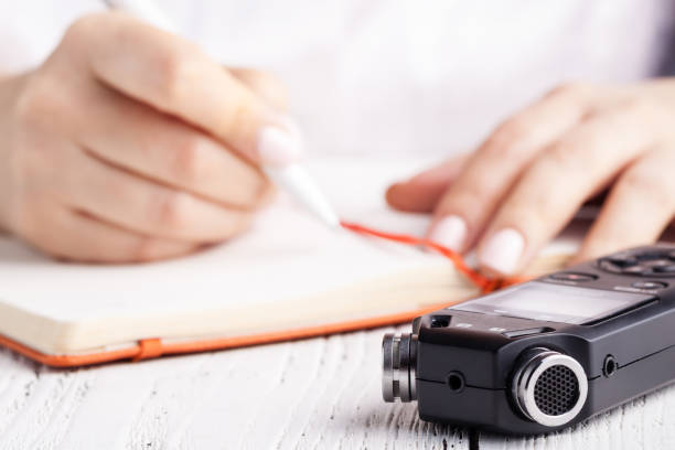 istock recording lecture on voice recorder instead of writing 1139846450