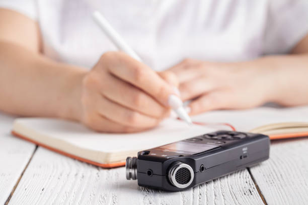 istock recording lecture on voice recorder instead of writing 1139846476